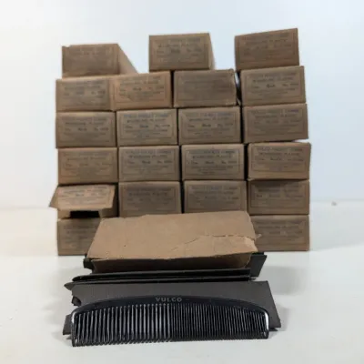 Sale Photo Thumbnail #67: Collection of vintage Vulco pocket combs in original cardboard packaging boxes.