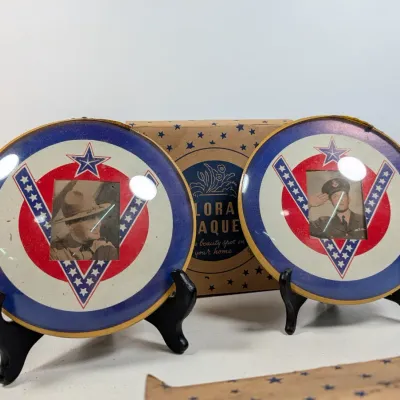Sale Photo Thumbnail #81: Pair of WWII-era patriotic 'V for Victory' convex glass photo plaques with military portraits, displayed with their original box.
