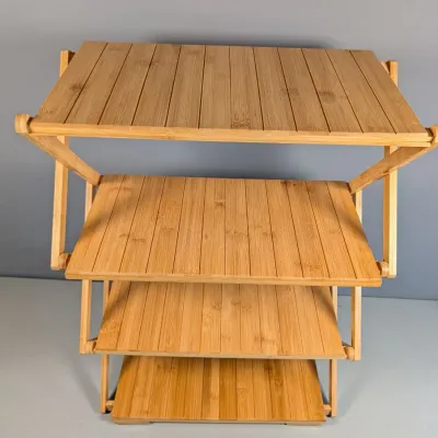 Sale Photo Thumbnail #147: Four-tier folding bamboo storage rack with slatted shelves.