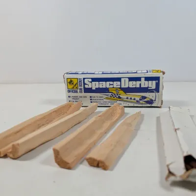 Sale Photo Thumbnail #409: Vintage Official Cub Scout Space Derby kit with balsa wood blocks and original packaging box.
