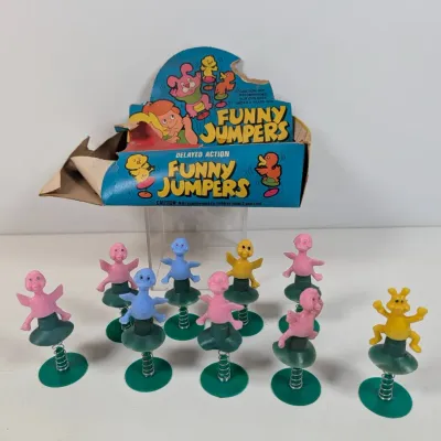 Sale Photo Thumbnail #308: Vintage Delayed Action Funny Jumpers novelty pop-up toys, featuring ten colorful plastic animal figures on spring bases along with their original torn display box.