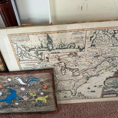 Sale Photo Thumbnail #276: Framed historical map reproduction of North America paired with a colorful Mexican amate bark folk art painting.