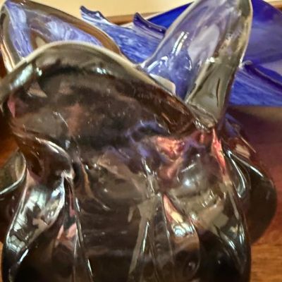 Sale Photo Thumbnail #22: Mid-century modern hand-blown art glass vase featuring a ruffled rim and deep purple-tinted clear glass.