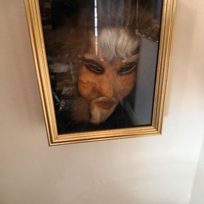 Sale Photo Thumbnail #113: Framed vintage theatrical or Noh-style mask featuring faux hair accents and a textured facial finish in a ribbed gold-toned frame.