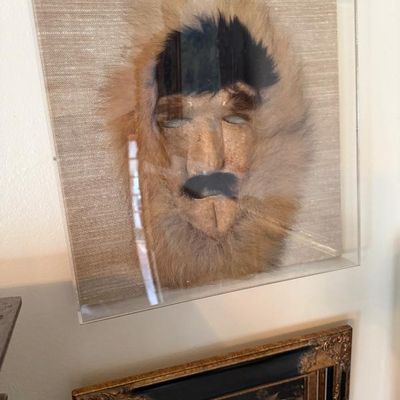 Sale Photo Thumbnail #112: Alaskan Inuit fur mask framed inside a clear acrylic display case.