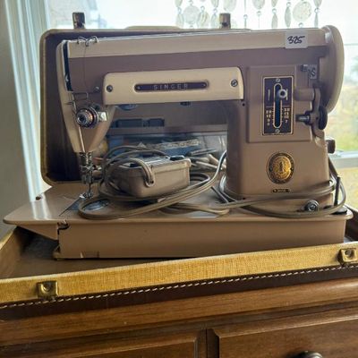 Sale Photo Thumbnail #189: Vintage Singer 301A slant-needle sewing machine in a tan and cream finish, complete with foot pedal and original carrying case base.