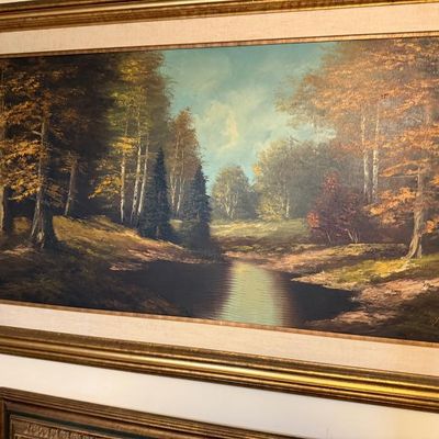 Sale Photo Thumbnail #55: Large vintage oil painting depicting a forest landscape with a stream in an ornate gilt wood frame with a linen liner.