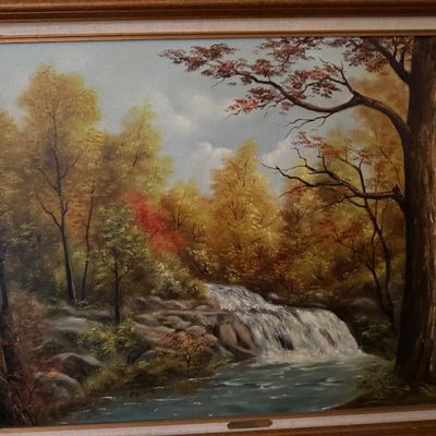 Sale Photo Thumbnail #57: Framed oil painting on canvas depicting a tranquil forest landscape with a cascading waterfall and autumn foliage, signed by the artist in the lower right corner.