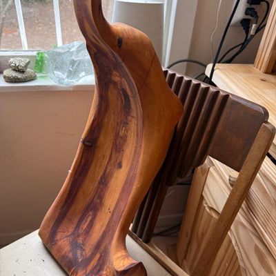 Sale Photo Thumbnail #375: Hand-carved live-edge cedar wood bowl with a natural freeform shape and rich wood grain.