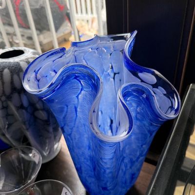Sale Photo Thumbnail #23: Cobalt blue and white spatter art glass vase featuring a ruffled, handkerchief-style rim.