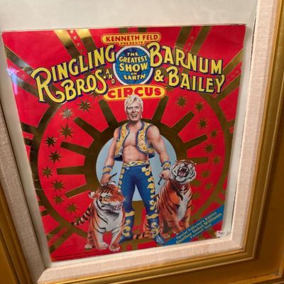 Sale Photo Thumbnail #60: Framed Ringling Bros. and Barnum & Bailey Circus program cover featuring Gunther Gebel-Williams and his tigers, presented in a matted gold frame.