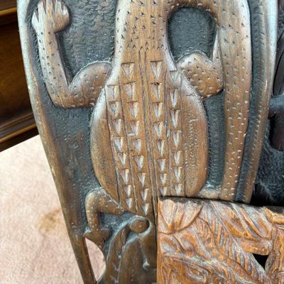 Sale Photo Thumbnail #218: Hand-carved wooden panel depicting a textured lizard motif in relief, featuring detailed geometric scale patterns.