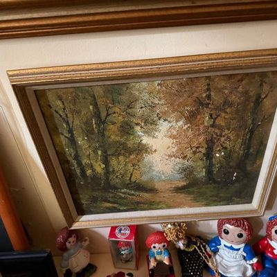 Sale Photo Thumbnail #56: Framed oil painting depicting a forest path in autumn hues, housed in a molded wood frame with gilt detailing.