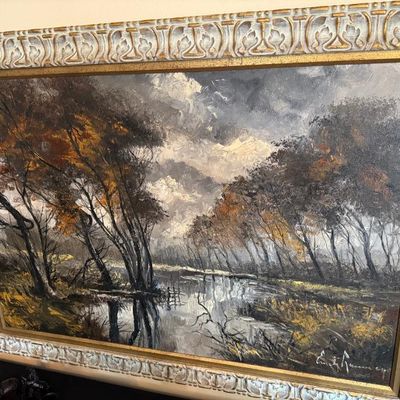 Sale Photo Thumbnail #97: Framed mid-century oil painting depicting an autumnal river landscape with stormy skies, signed by the artist in the lower right corner.