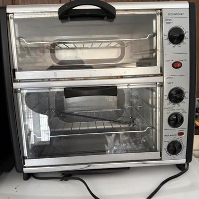 Sale Photo Thumbnail #365: Technochef double door toaster oven and rotisserie unit in stainless steel and black trim.