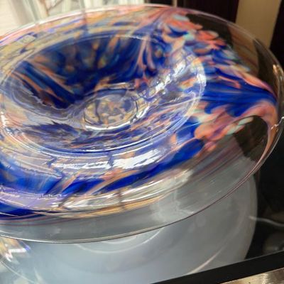 Sale Photo Thumbnail #24: Hand-blown art glass shallow bowl featuring swirl patterns in vivid shades of cobalt blue, coral, and white.