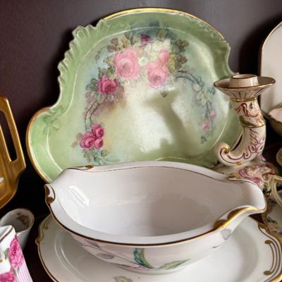 Sale Photo Thumbnail #333: Collection of vintage hand-painted porcelain table items, including a floral gravy boat with underplate and a green tray with pink rose motifs.