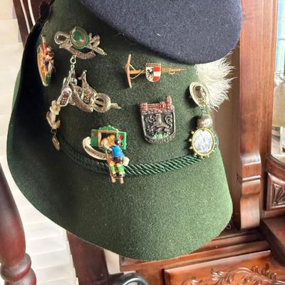 Sale Photo Thumbnail #238: Traditional green German Tyrolean wool felt alpine hat, decorated with various souvenir pins and badges.