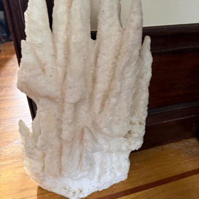 Sale Photo Thumbnail #128: Large white calcite or aragonite speleothem rock formation specimen with multiple spires, resting on a hardwood floor.