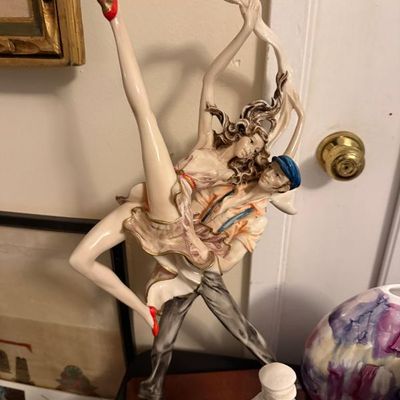 Sale Photo Thumbnail #162: Vintage Capodimonte-style porcelain figurine depicting a dancing couple on a wooden base, featuring detailed hand-painted accents.
