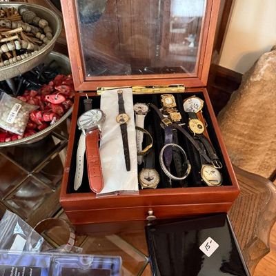 Sale Photo Thumbnail #31: Wooden glass-top display box filled with a collection of vintage and modern men's and women's wristwatches.