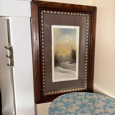 Sale Photo Thumbnail #84: Framed antique winter landscape print or painting featuring a snowy scene with a fence and house, set in a dark wooden frame with beaded inner trim.