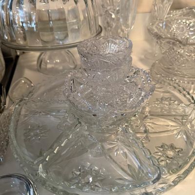 Sale Photo Thumbnail #306: Collection of vintage cut glass tableware, including a divided server tray, a footed cake dome, and assorted decorative glassware.