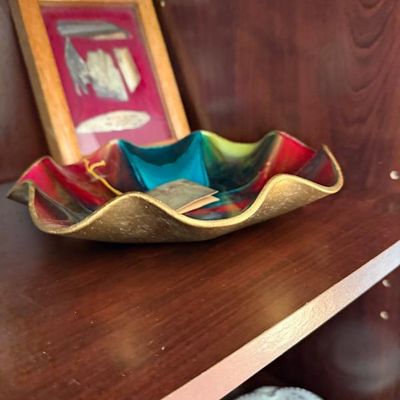Sale Photo Thumbnail #248: Vintage colorful art glass ruffled dish with gold-tone rim, displayed alongside a framed shadow box with specimen mounts.
