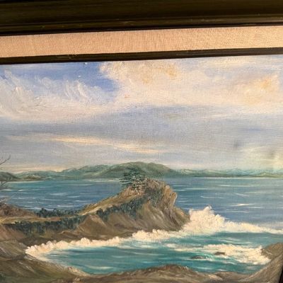 Sale Photo Thumbnail #47: Framed oil painting depicting a coastal landscape with crashing waves and rocky cliffs, set in a wood frame with a linen mat.