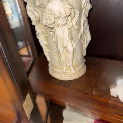 Sale Photo Thumbnail #291: Vintage classical-style cast resin vase featuring relief sculptures of three maiden figures around the exterior.