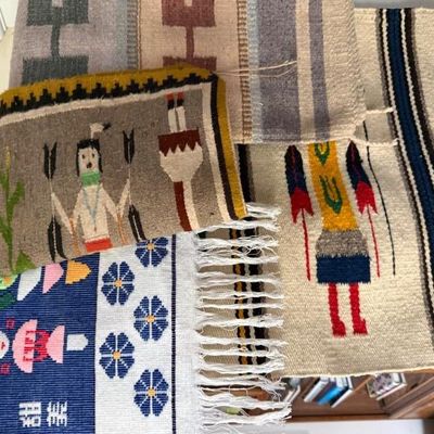 Sale Photo Thumbnail #237: Collection of small hand-woven textiles and rugs, featuring Southwest-style Yei pictorial motifs and geometric designs.