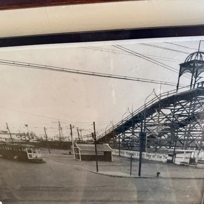 Sale Photo Thumbnail #110: Framed black-and-white historical photograph depicting an early 20th-century streetcar scene alongside a wooden roller coaster structure.
