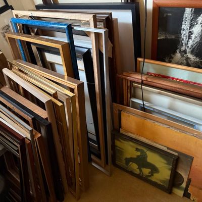 Sale Photo Thumbnail #124: Large collection of assorted picture frames and framed artwork, including wooden, metal, and painted frames in various sizes.