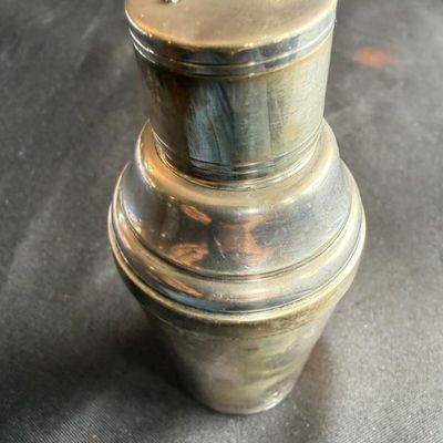Sale Photo Thumbnail #7: Vintage silver-plated cocktail shaker featuring an enameled French flag emblem on the lid.
