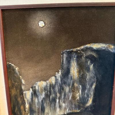 Sale Photo Thumbnail #100: Vintage black velvet painting depicting a moonlit canyon landscape, framed with a linen liner and dark wooden molding.