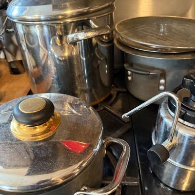 Sale Photo Thumbnail #368: Assortment of used stainless steel and nonstick cookware, including stock pots with lids and an espresso maker steamer Attachment.