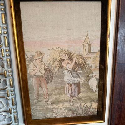 Sale Photo Thumbnail #98: Framed vintage woven tapestry art depicting a pastoral scene with figures harvesting wheat in a gilded wooden frame.