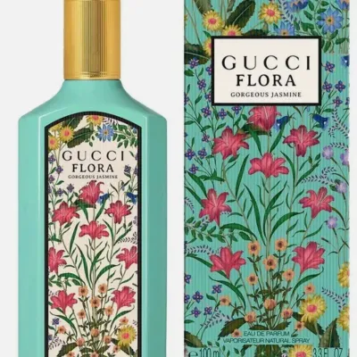 Gucci Flora Gorgeous Jasmine Eau de Parfum, 100 mL / 3.3 fl oz, in a turquoise bottle alongside its original floral-patterned box.