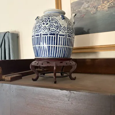Sale Photo Thumbnail #67: Chinese blue and white porcelain ginger jar featuring geometric and floral patterns, set on a carved wooden display stand.