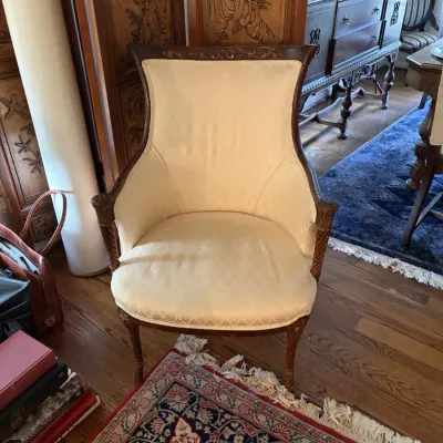 Sale Photo Thumbnail #15: French Provincial style armchair featuring carved dark wood trim and cream damask pattern upholstery.
