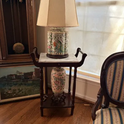 Sale Photo Thumbnail #6: Chinese Famille Rose porcelain ginger jar lamp featuring peacock and floral motifs, sitting on a marble-top accent table next to a matching vase.