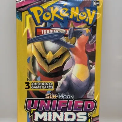 Sealed Pokémon Sun & Moon Unified Minds 3-card booster pack featuring Garchomp artwork.