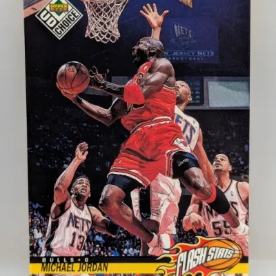 1998-99 Upper Deck UD Choice Michael Jordan 'Flash Stats' trading card #FS2, depicting Jordan driving to the hoop against the...