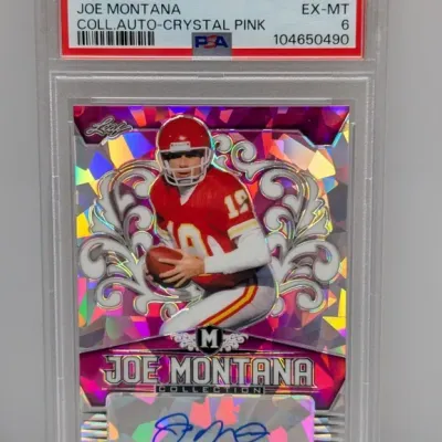 2020 Leaf Metal Joe Montana Collection Auto-Crystal Pink trading card, graded PSA EX-MT 6. Features a blue ink autograph on a pink foil...