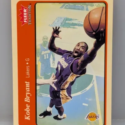 Kobe Bryant Fleer Tradition basketball trading card featuring the Los Angeles Lakers guard in good overall condition.