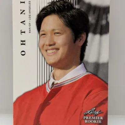 Shohei Ohtani 2018 Leaf Premier Rookie baseball trading card featuring a portrait in Los Angeles Angels apparel, presented in good...