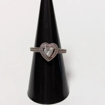 Pandora sterling silver heart-shaped halo ring featuring a central clear crystal stone and beaded band detail.