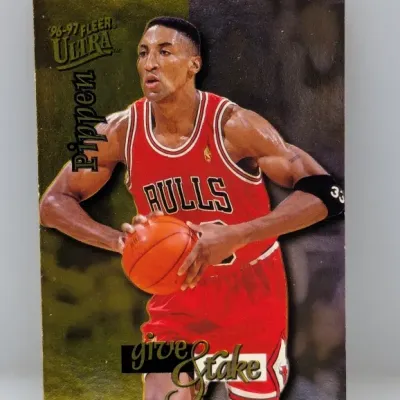 1996-97 Fleer Ultra 'Give and Take' Scottie Pippen basketball trading card featuring him in his Chicago Bulls uniform.