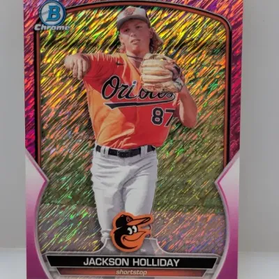 Bowman Chrome Jackson Holliday baseball trading card featuring a pink shimmer refractor border and sharp corners.