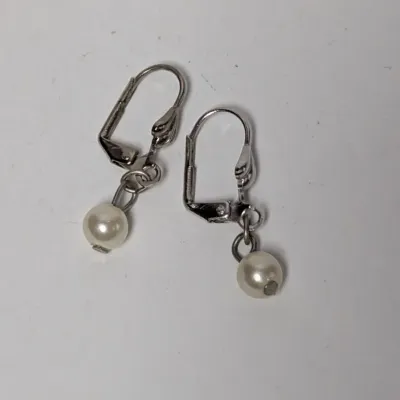 Pair of silver-tone lever-back dangle earrings featuring small faux pearl beads.